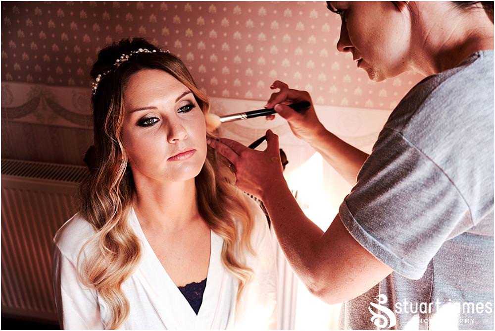 Creative bridal makeup photographs at Bishton Hall in Stafford by Documentary Wedding Photographer Stuart James