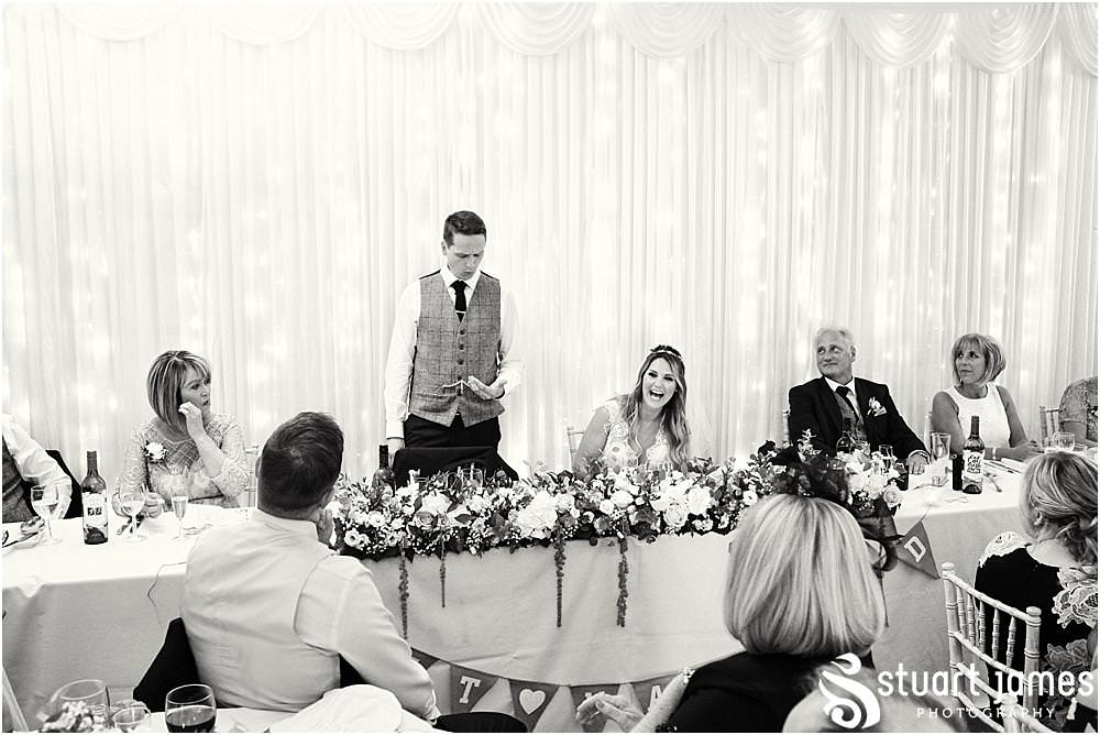 Capturing the Grooms speech and the reaction from the guests at Bishton Hall in Stafford by Documentary Wedding Photographer Stuart James