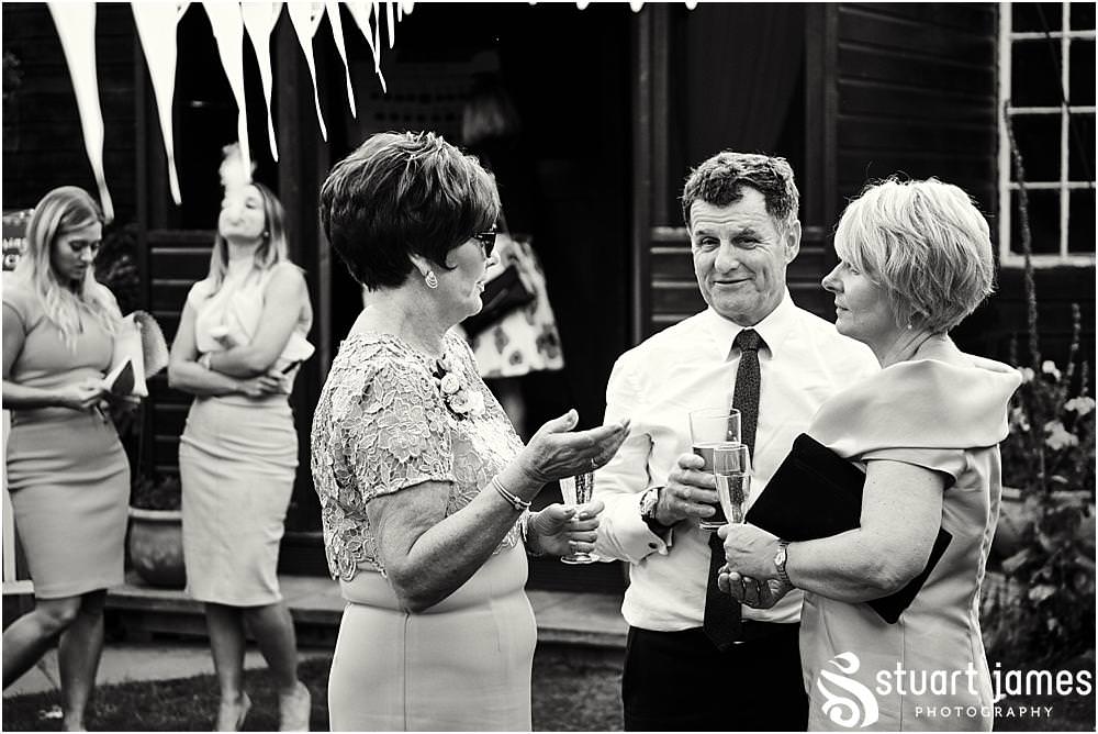 Relaxed creative candid photographs of the guests enjoying the fabulous wedding dat at Bishton Hall in Stafford by Documentary Wedding Photographer Stuart James