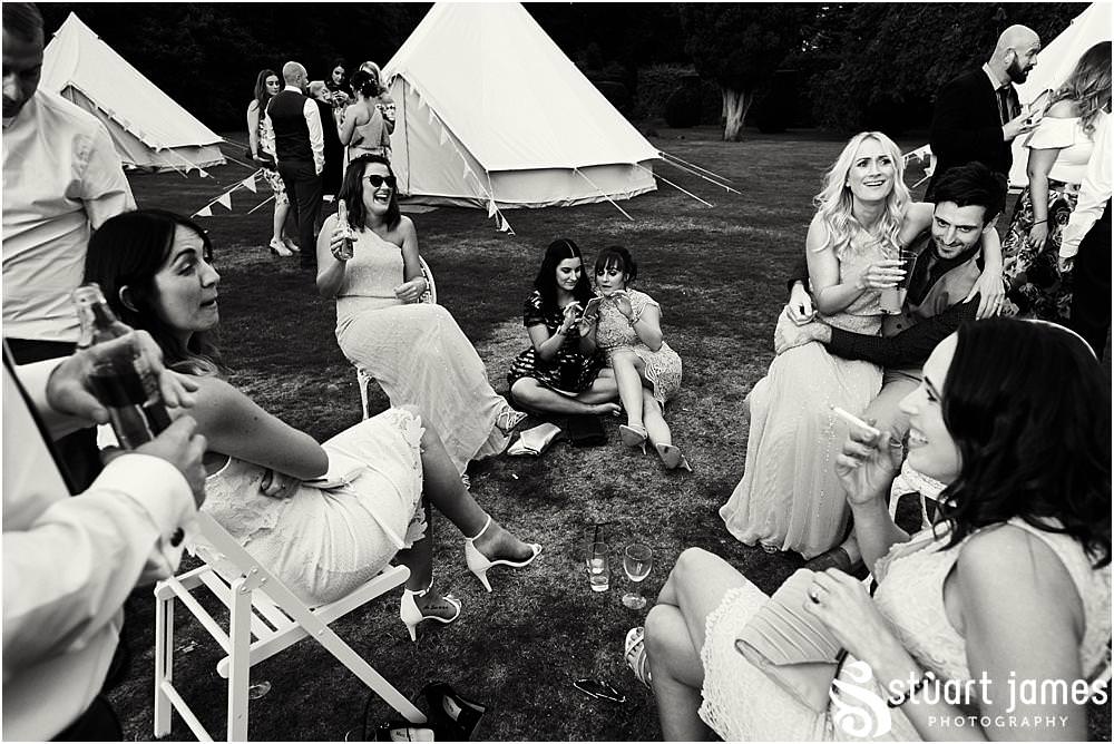 Unobtrusive photographs that capture the real moments of the wedding day as the guests relax and enjoy the evening reception at Bishton Hall in Stafford by Documentary Wedding Photographer Stuart James