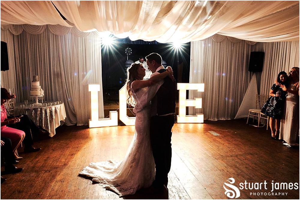 Creative dance floor photographs as the Bride and Groom enjoy their first dance together at Bishton Hall in Stafford by Documentary Wedding Photographer Stuart James