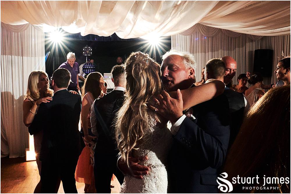 Beautiful moment captured as the Bride and Father of the Bride share a dance on the wedding day at Bishton Hall in Stafford by Documentary Wedding Photographer Stuart James
