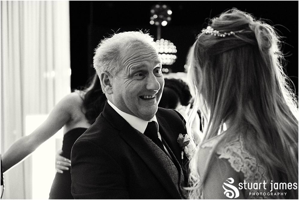 Beautiful moment captured as the Bride and Father of the Bride share a dance on the wedding day at Bishton Hall in Stafford by Documentary Wedding Photographer Stuart James