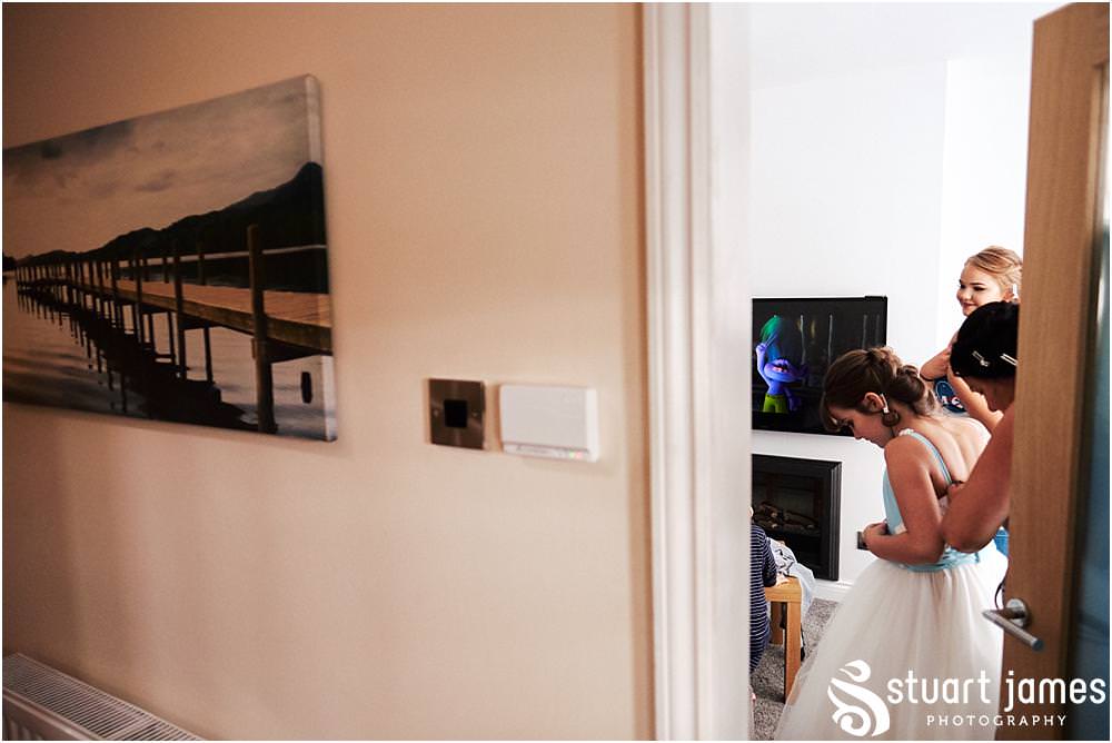 Bridal hair and makeup photographs ahead of the wedding at St Marks Church Great Wyrley in Walsall by Documentary Wedding Photographer Stuart James