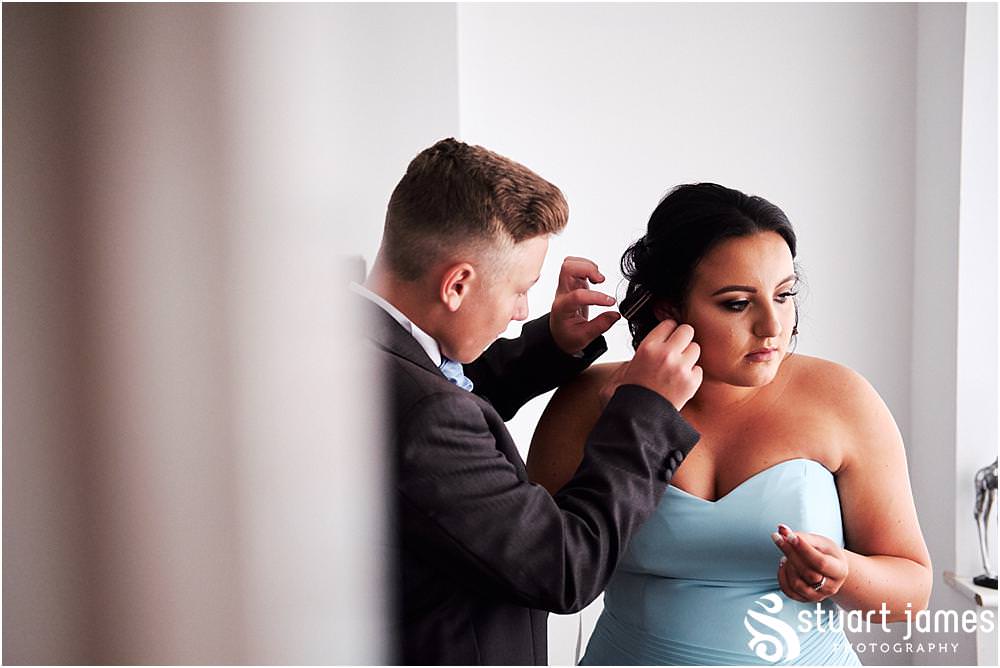 Bridal hair and makeup photographs ahead of the wedding at St Marks Church Great Wyrley in Walsall by Documentary Wedding Photographer Stuart James