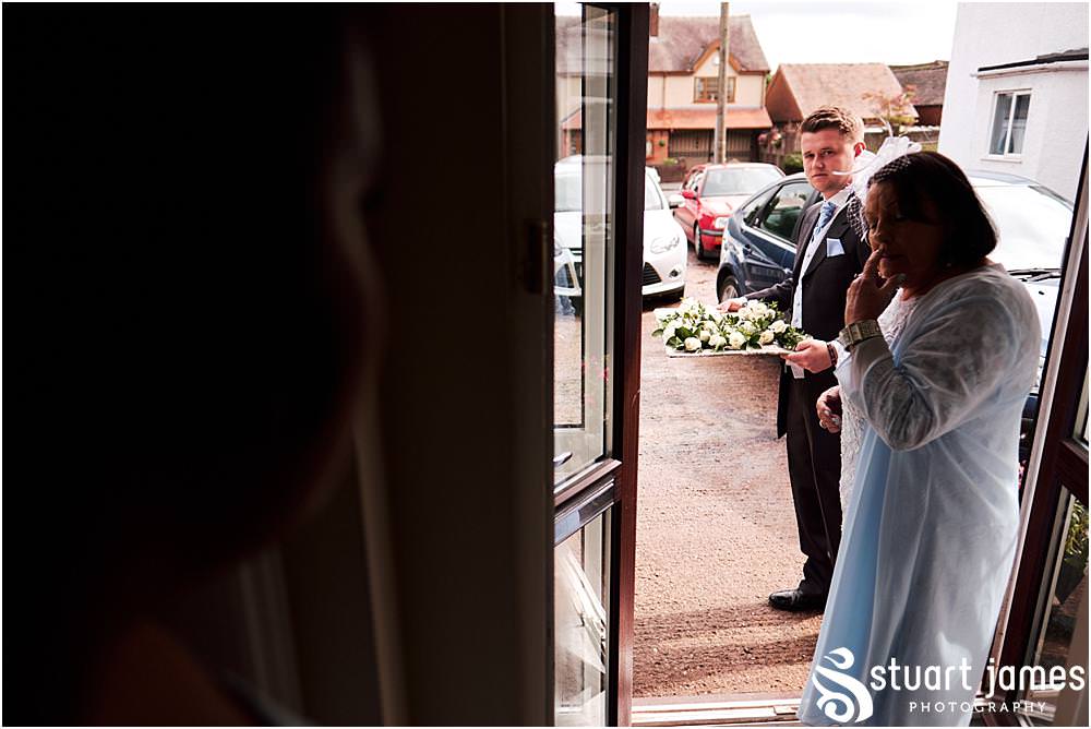 Creative photographs of the wedding preparations of the bridal party ahead of the wedding at St Marks Church Great Wyrley in Walsall by Documentary Wedding Photographer Stuart James