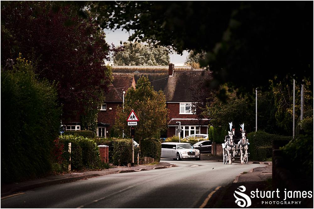 Beautiful photographs of the brides journey to church with Horse and Carriage at St Marks Church Great Wyrley in Walsall by Documentary Wedding Photographer Stuart James