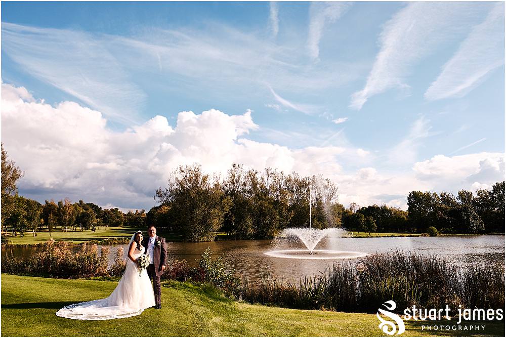Creative portraits of the bride and groom at the lakeside at Calderfields in Walsall by Documentary Wedding Photographer Stuart James