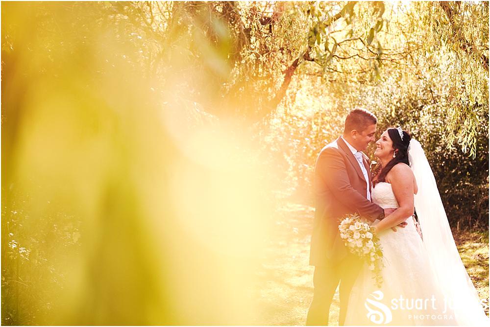 Utilising the stunning grounds for beautiful portraits of the bride and groom at Calderfields in Walsall by Documentary Wedding Photographer Stuart James