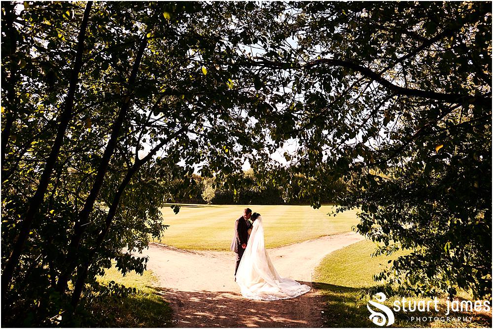 Utilising the stunning grounds for beautiful portraits of the bride and groom at Calderfields in Walsall by Documentary Wedding Photographer Stuart James
