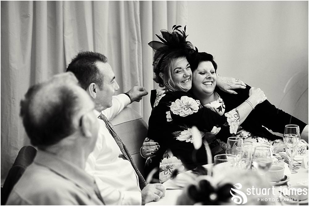Capturing the guests relaxed and enjoying the wedding breakfast with creative candid photographs by Documentary Wedding Photographer Stuart James