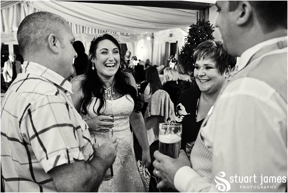 Candid photographs capturing the spirit and fun of the evening reception as the guests enjoy the fabulous wedding at Calderfields by Documentary Wedding Photographer Stuart James