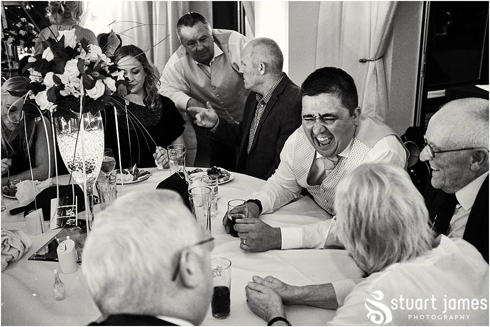 Candid photographs capturing the spirit and fun of the evening reception as the guests enjoy the fabulous wedding at Calderfields by Documentary Wedding Photographer Stuart James