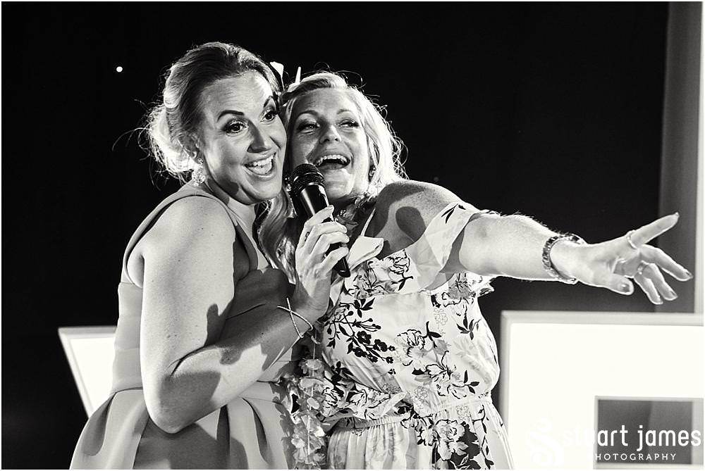 Candid photographs capturing the spirit and fun of the evening reception as the guests enjoy the fabulous wedding at Calderfields by Documentary Wedding Photographer Stuart James
