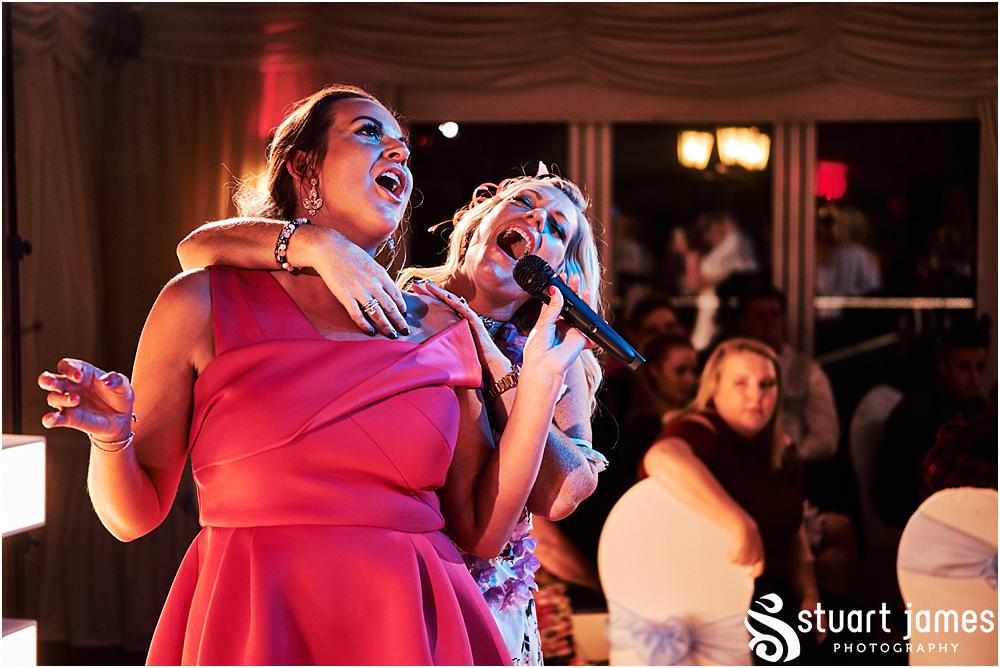 Candid photographs capturing the spirit and fun of the evening reception as the guests enjoy the fabulous wedding at Calderfields by Documentary Wedding Photographer Stuart James