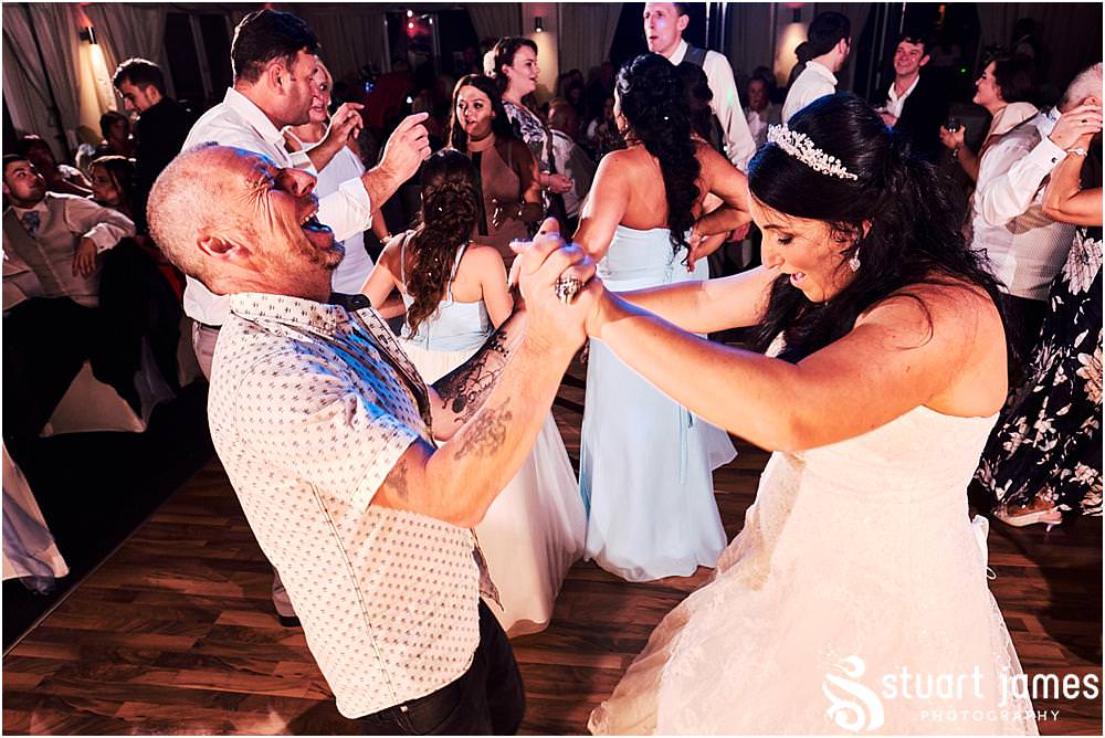 Photos that capture the guests having the most amazing time partying away on the dance floor at Calderfields by Documentary Wedding Photographer Stuart James