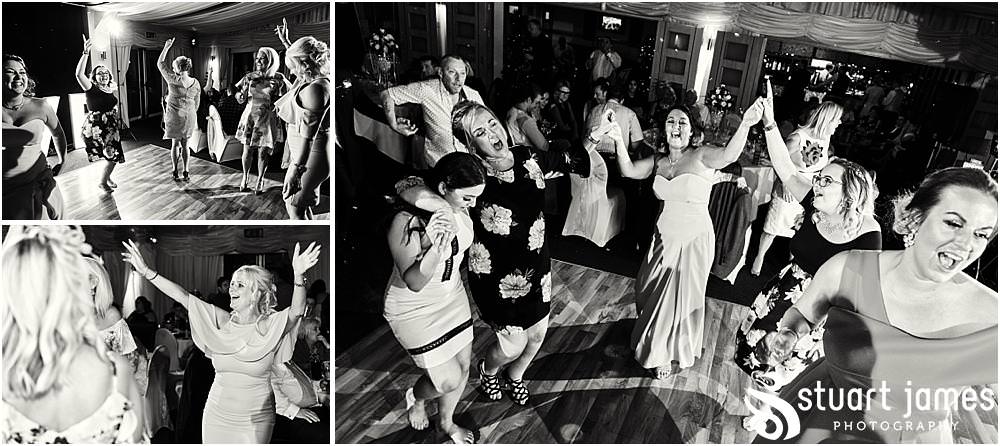 Photos that capture the guests having the most amazing time partying away on the dance floor at Calderfields by Documentary Wedding Photographer Stuart James