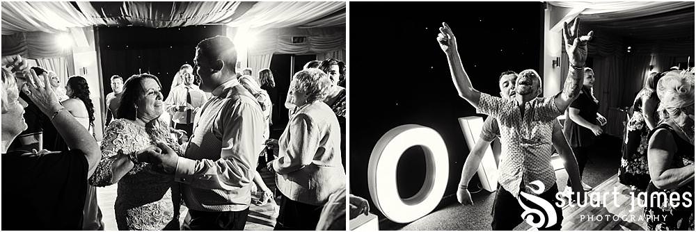 Photos that capture the guests having the most amazing time partying away on the dance floor at Calderfields by Documentary Wedding Photographer Stuart James