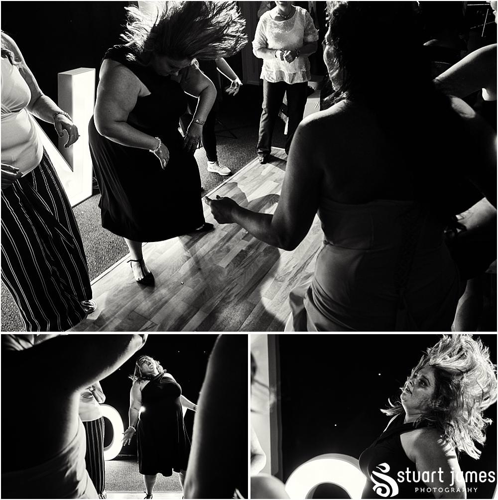Photos that capture the guests having the most amazing time partying away on the dance floor at Calderfields by Documentary Wedding Photographer Stuart James