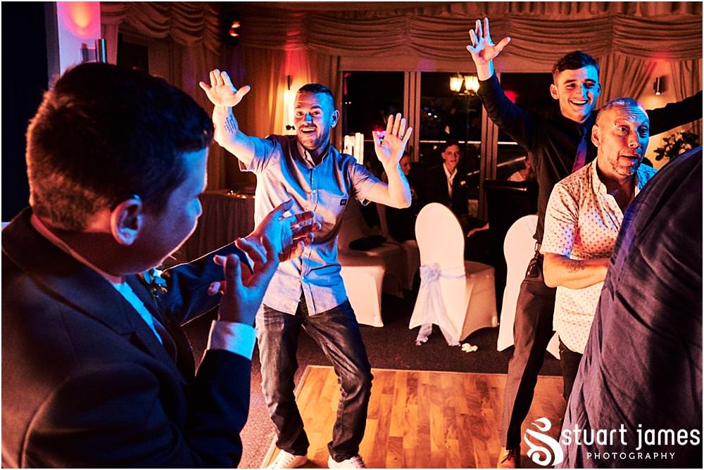 Photos that capture the guests having the most amazing time partying away on the dance floor at Calderfields by Documentary Wedding Photographer Stuart James