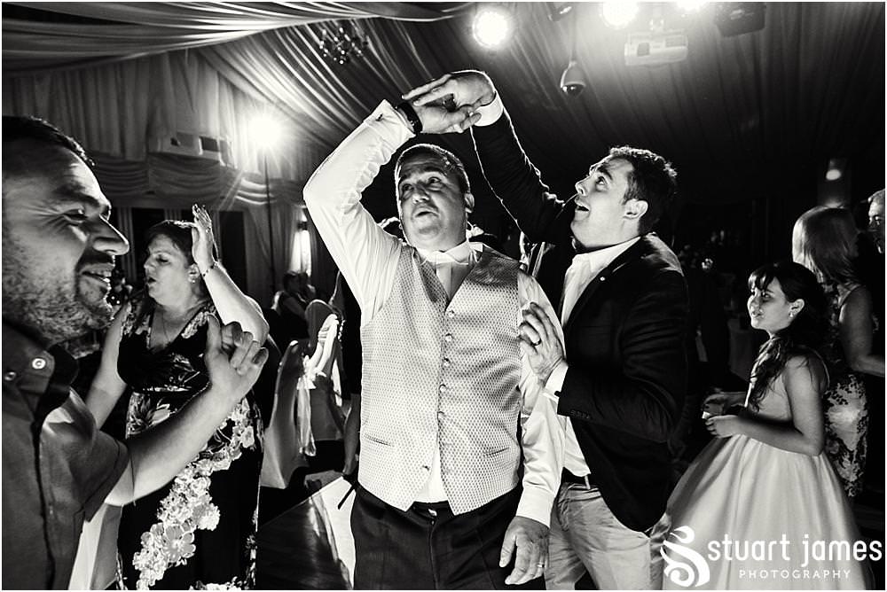 Photos that capture the guests having the most amazing time partying away on the dance floor at Calderfields by Documentary Wedding Photographer Stuart James