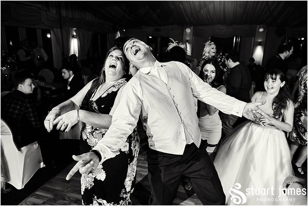 Photos that capture the guests having the most amazing time partying away on the dance floor at Calderfields by Documentary Wedding Photographer Stuart James