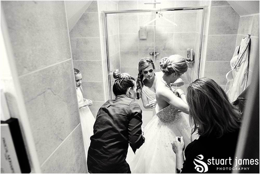 Capturing the most precious moments as the bride dresses in her perfect designer gown and brings the grand reveal to the emotional and waiting Father of the Bride at Moor Hall in Sutton Coldfield by Documentary Wedding Photographer Stuart James
