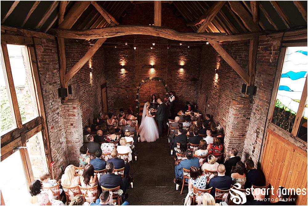 Creative unobtrusive photographs that truly capture the wedding ceremony in the barn at Packington Moor in Lichfield by Documentary Wedding Photographer Stuart James CREATIVE. EMOTIVE. STORYTELLING. Staffordshire Barn Wedding Photographs