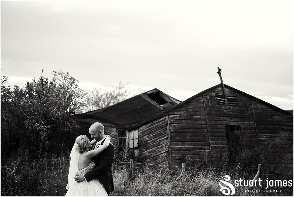 Creative evening portraits of the bride and groom in the countryside setting at Packington Moor in Lichfield by Documentary Wedding Photographer Stuart James CREATIVE. EMOTIVE. STORYTELLING. Staffordshire Barn Wedding Photographs