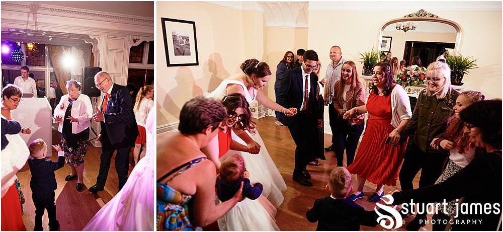 First dance and partying fun at Chester Zoo in Chester by Documentary Wedding Photographer Stuart James