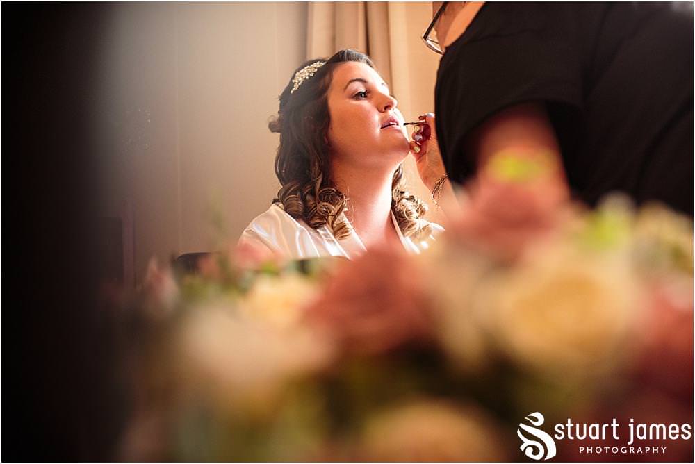 Finishing touches to the bridal makeup as the wedding drawers near at Oak Farm in Cannock by Oak Farm Wedding Photographer Stuart James