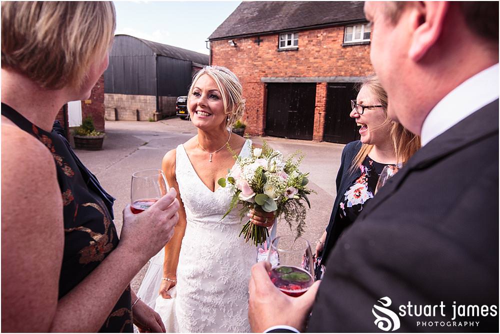 Relaxed fun candid photographs capturing the guests enjoying the summer conditions in the gardens at Packington Moor Barn in Lichfield | Lichfield Barn Wedding Photographs by Documentary Wedding Photographer Stuart James
