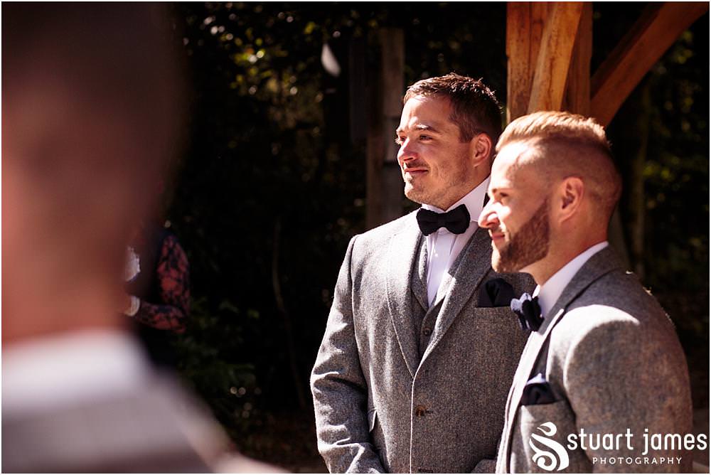 Beautiful photographs of the wedding ceremony on the lakeside at Moddershall Oaks captured by Moddershall Oaks Wedding Photographer Stuart James