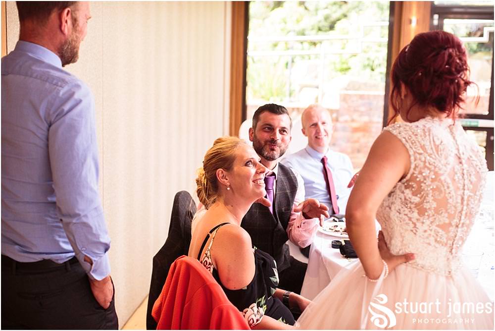 Creative documentary photographs of the wedding guests enjoying the reception at Moddershall Oaks captured by Moddershall Oaks Wedding Photographer Stuart James