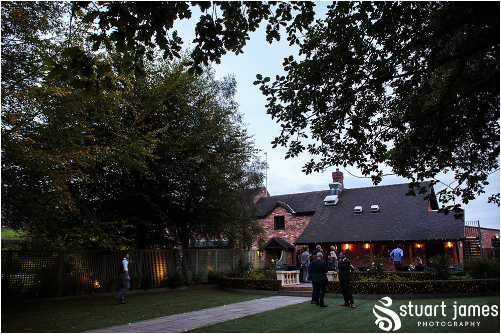 Candid photographs of the wedding reception at Moddershall Oaks captured by Moddershall Oaks Wedding Photographer Stuart James