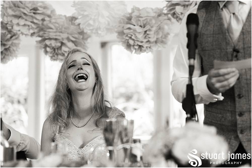 Capturing the speeches and the reactions of the guests with creative documentary photography at Moxhull Hall in Sutton Coldfield by Moxhull Hall Wedding Photographers Stuart James