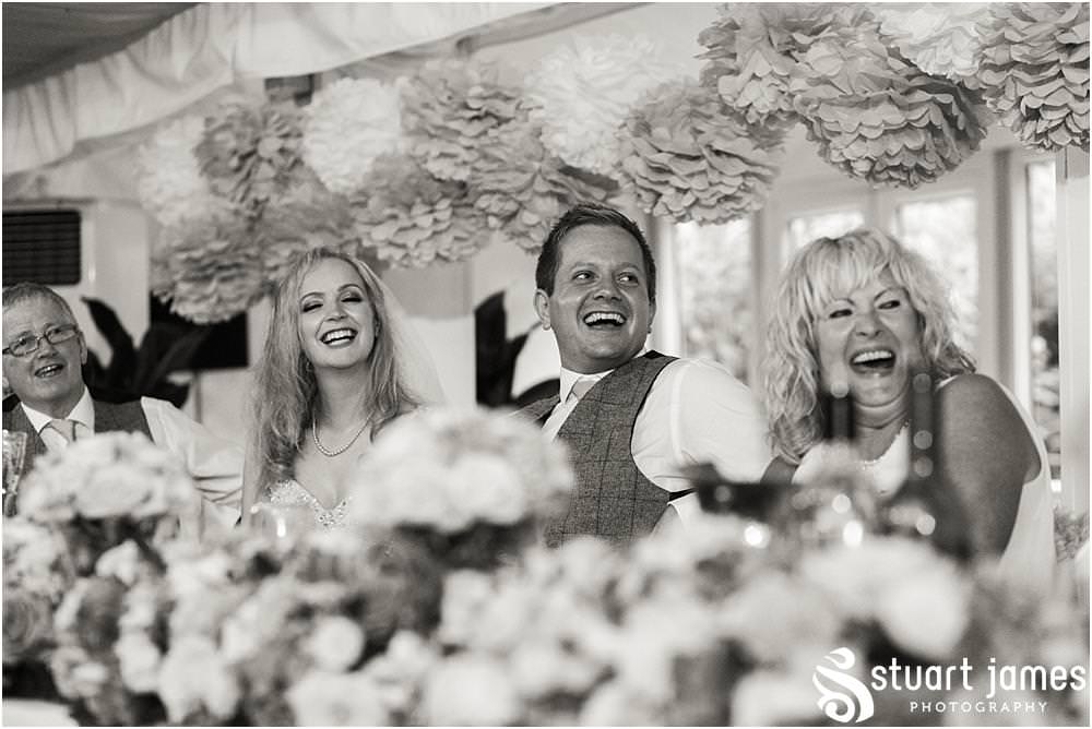 Creative candid photographs that capture the speeches and the fabulous guest reactions at Moxhull Hall in Sutton Coldfield by Moxhull Hall Wedding Photographers Stuart James