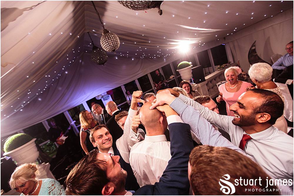 Immersed in the centre of the party, capturing the true spirit of the wedding party at Moxhull Hall in Sutton Coldfield by Moxhull Hall Wedding Photographers Stuart James