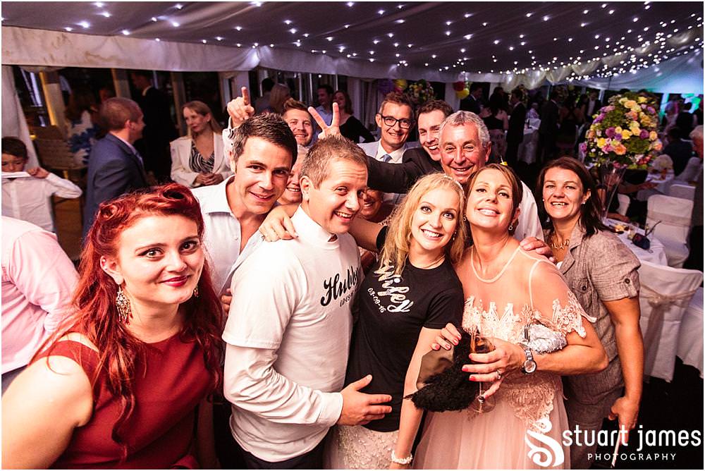 Immersed in the centre of the party, capturing the true spirit of the wedding party at Moxhull Hall in Sutton Coldfield by Moxhull Hall Wedding Photographers Stuart James