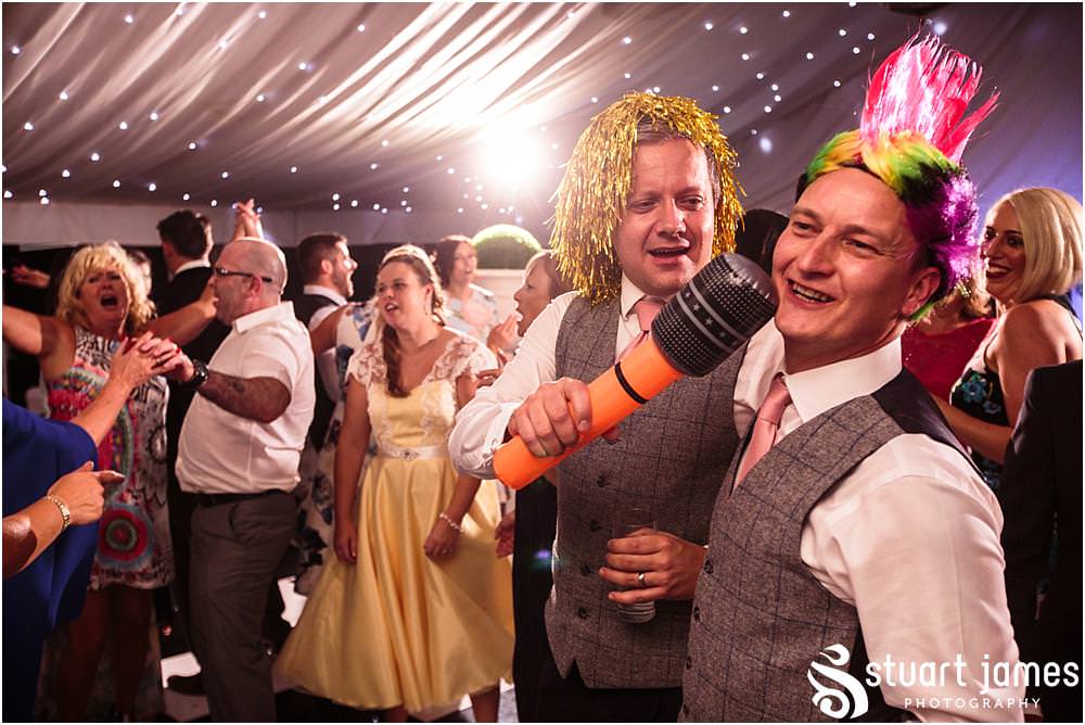 Right in the midst of the party, capturing the truly amazing time the bride and groom were having partying with their guests on the dance floor at Moxhull Hall in Sutton Coldfield by Moxhull Hall Wedding Photographers Stuart James