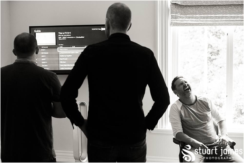 Creative candid photographs capturing the groomsmen preparations for the wedding at Pendrell Hall with Pendrell Hall Wedding Photography by Stuart James