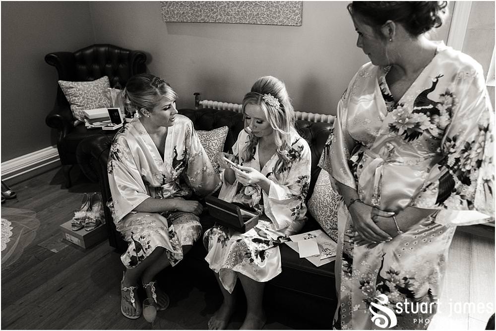 Gift time always brings amazing emotions to capture with the bridal party at Pendrell Hall with Pendrell Hall Wedding Photography by Stuart James