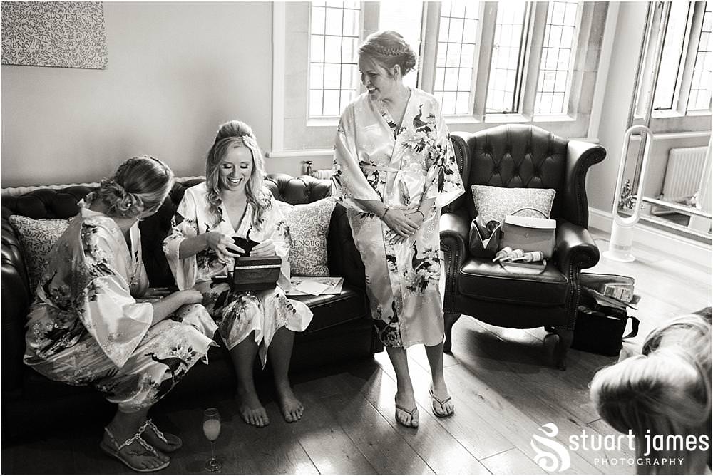 Gift time always brings amazing emotions to capture with the bridal party at Pendrell Hall with Pendrell Hall Wedding Photography by Stuart James