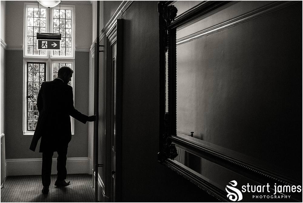 Capturing our groom heading to greet the guests arriving for the wedding at Pendrell Hall with Pendrell Hall Wedding Photography by Stuart James
