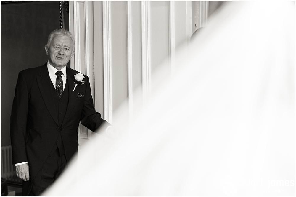 A truly stunning and memorable moment as the Father of the Bride sees his daughter as a bride for the first time at Pendrell Hall with Pendrell Hall Wedding Photography by Stuart James