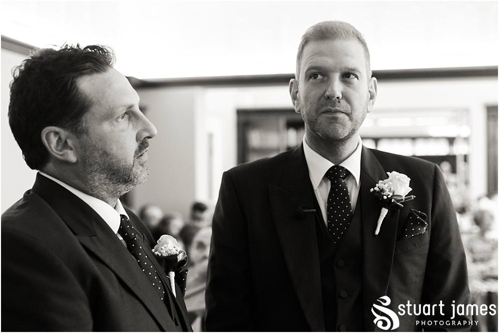 Capturing the beautiful and emotional ceremony in unobtrusive photographs at Pendrell Hall with Pendrell Hall Wedding Photography by Stuart James