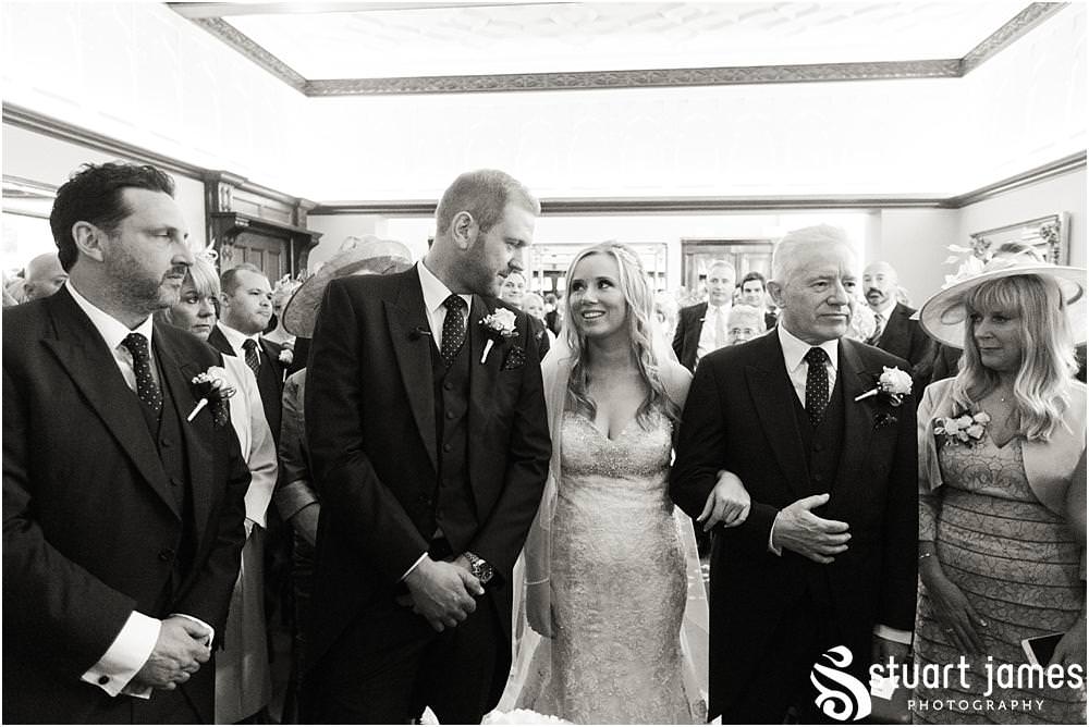 Capturing the beautiful and emotional ceremony in unobtrusive photographs at Pendrell Hall with Pendrell Hall Wedding Photography by Stuart James