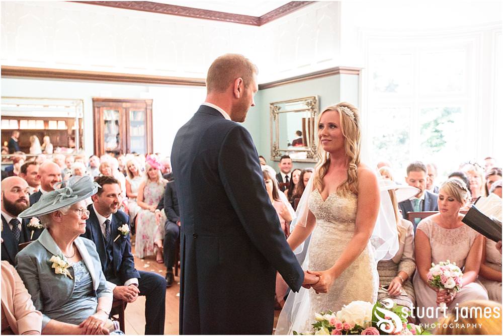 Capturing the beautiful and emotional ceremony in unobtrusive photographs at Pendrell Hall with Pendrell Hall Wedding Photography by Stuart James
