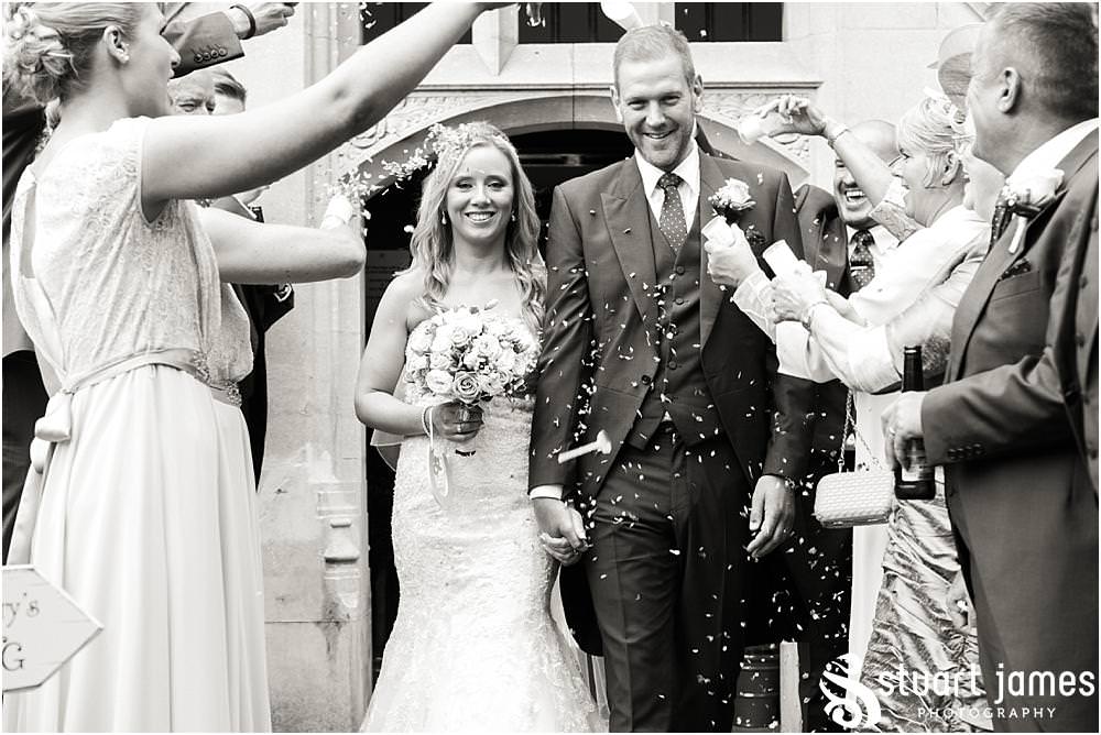 Confetti exit for the new Mr & Mrs Whitcroft at Pendrell Hall with Pendrell Hall Wedding Photography by Stuart James