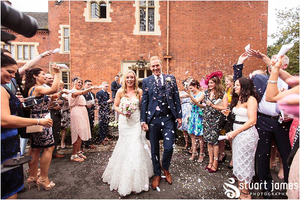 Confetti exit for the new Mr & Mrs Whitcroft at Pendrell Hall with Pendrell Hall Wedding Photography by Stuart James